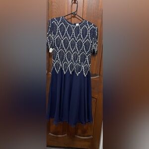Women’s size small P Navy blue 100% Silk evening dress. Heavily beaded, sequins